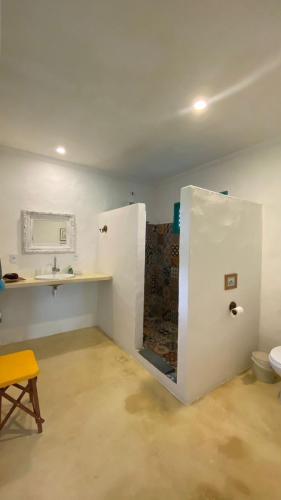 a bathroom with a sink and a toilet in a room at Kasa Karapató in Pôrto de Pedras