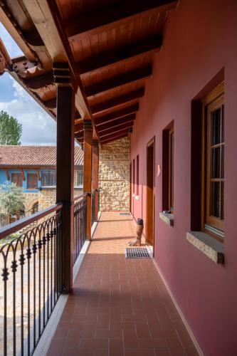 a porch of a house with a balcony at Blerina's Agritourism Concept in Laknas