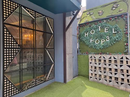a store front with a sign that reads hotel poop at Hotel POP3 Jongno in Seoul