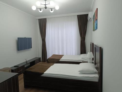 Postel nebo postele na pokoji v ubytování Maricel Astara Resort Hotel