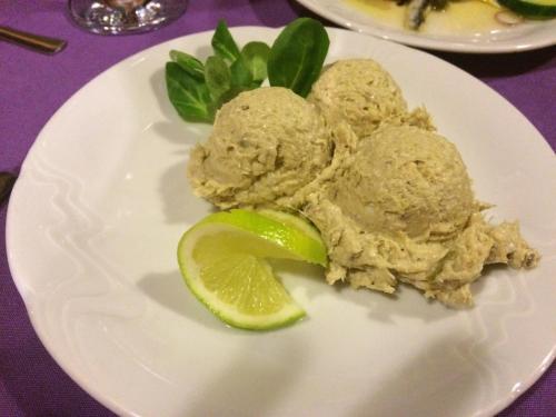 a white plate with a piece of food and a lime at Galeb Bed and Breakfast in Baćina