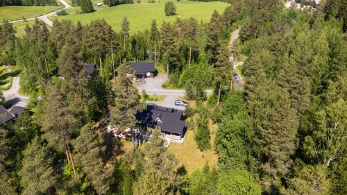 an aerial view of a house in the forest at Himos Huili 1 in Jämsä
