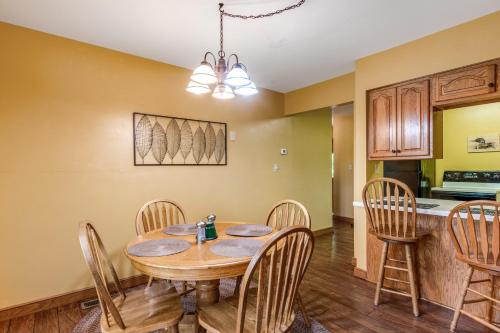 a kitchen and dining room with a wooden table and chairs at Loon's Landing in Mercer