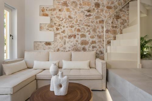 a living room with a couch and a table at il Campanile Luxury Living in Chania Town