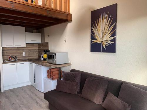 Η κουζίνα ή μικρή κουζίνα στο Duplex - Proche de Gérardmer