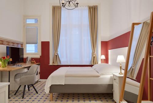 Postel nebo postele na pokoji v ubytování Hotel am Museum