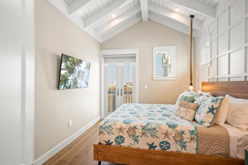 a bedroom with a bed and a window at Coastal luxury steps from the shore and resort amenities in Port Aransas