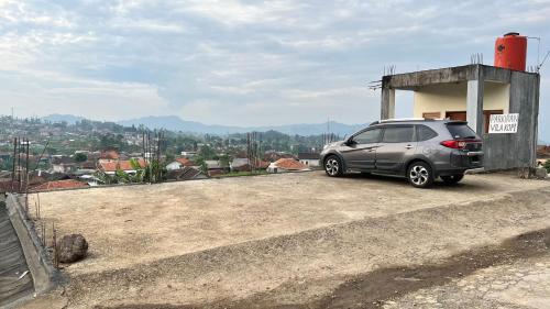 a silver car parked on top of a building at Vila Kopi Ciwidey in Ciwidey