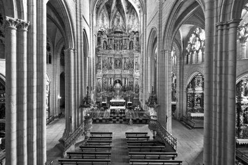 a black and white photo of a church with pews at Apartamento Turístico VIANA II in Viana