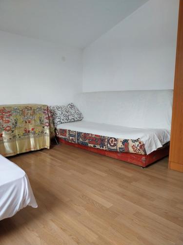 A bed or beds in a room at Budva Apartman