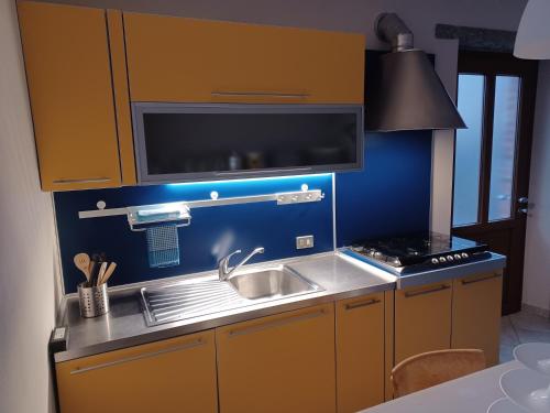 a kitchen with a sink and a stove at Residenza Jasmine in Verbania