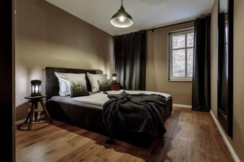 a bedroom with a large bed and a window at NeuWerk in Erfurt