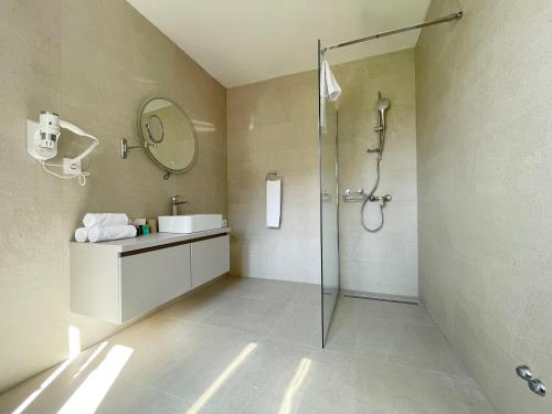a bathroom with a shower and a sink at Villa Ardura - island holiday residence **** Bol. Island Brač in Bol