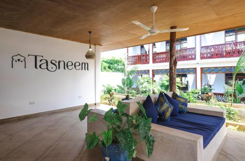 a room with a bed in front of a building at TASNEEM islamic luxury suites in Jambiani