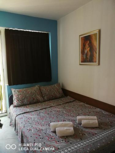 a bedroom with a bed with two pillows on it at Villa Ohrid Anastasia in Ohrid