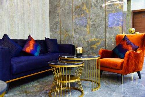 a living room with a couch and two chairs at MIRANDA HOTEL - Tanger in Tangier