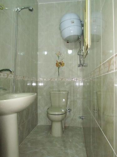 a bathroom with a toilet and a sink at Arabian Nights Hostel in Cairo