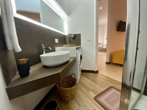 a bathroom with a white sink on a counter at “Bedda Mattri” dimora siciliana in Avola