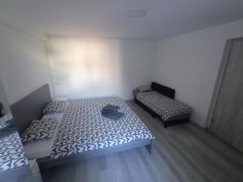 Postel nebo postele na pokoji v ubytování Apartmaja Eva&Pia