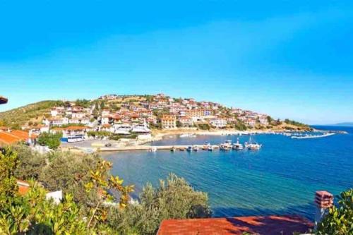 a view of a small island with boats in the water at •Naiades Villas• Odysseus• in Ladharió