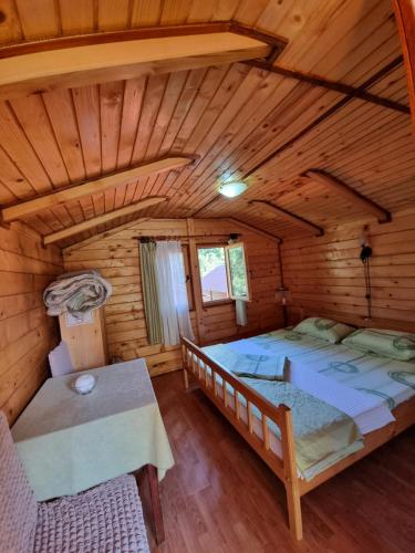 an overhead view of a bedroom in a log cabin at Ethno Village Koljeno Camp & Bungalows in Andrijevica