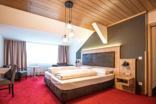 a large bedroom with a large bed in a room at Landgastohf Thiem in Waischenfeld