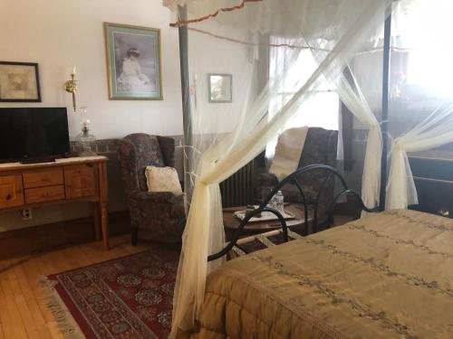 Ένα ή περισσότερα κρεβάτια σε δωμάτιο στο The Pembrooke Inn
