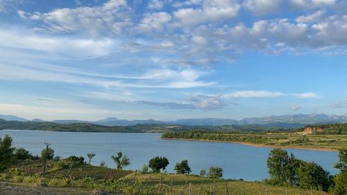 a view of a lake with mountains in the background at Sibora Guest House Liqeni Ulez 