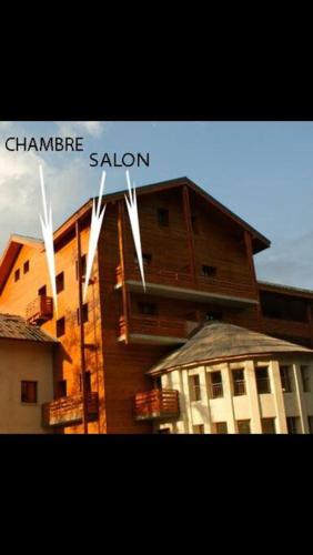 a sign that says chaminade saloon on top of a building at 2 pièces, au pied des pistes ds Résidence Gd Hôtel in Valberg