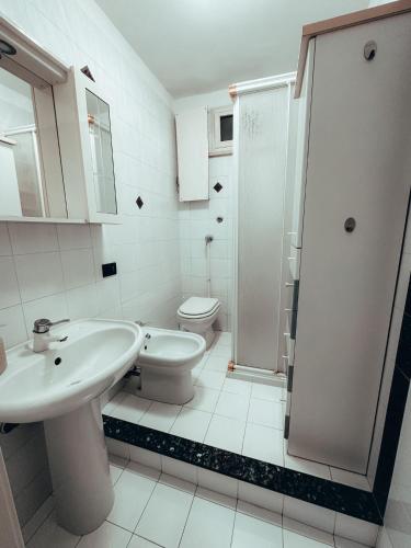 a bathroom with a sink and a toilet and a shower at Da Paolo e Antonietta in Mazara del Vallo
