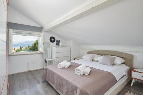 En eller flere senge i et værelse på Sea view house Cavtat
