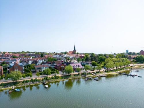 an aerial view of a town next to a river at Gemütliche 2-Zimmer-Wohnung in Neustadt in Holstein