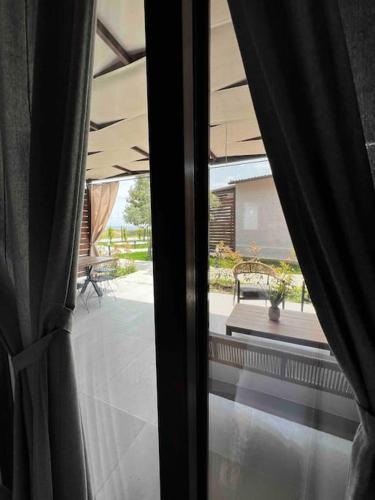 a view of a patio from a window of a house at •Naiades Villas•Meliti• in Ladharió