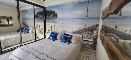 a bedroom with a mural of the beach at L'Amouage Casablanca Location Journalière Casablanca in Casablanca