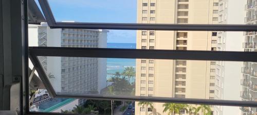 a view of the ocean from a window at Waikiki Condo 2 Bedrooms 2 Bathrooms with 1 free parking space in Honolulu