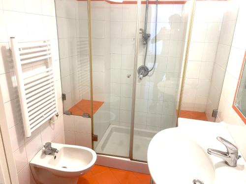 a bathroom with a shower and a toilet and a sink at Villa La Zagara by CapriRooms in Capri
