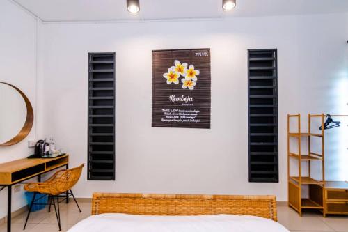 a bedroom with a bed and a desk and a wall with shutters at The Best Hotel in Bayan Lepas - THE LOV PENANG in Bayan Lepas