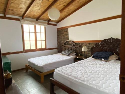 Ліжко або ліжка в номері Casa de campo con piscina en Asia