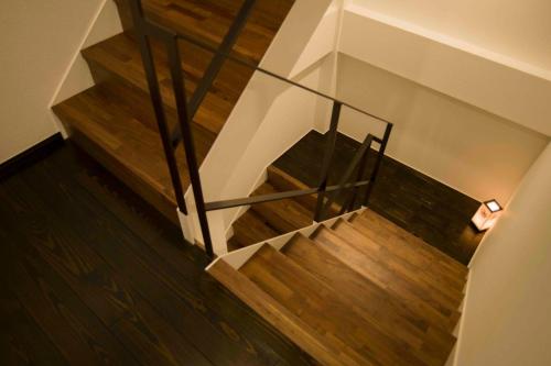an overhead view of a staircase with wooden floors at Shinjuku Miyabi Residence - Vacation STAY 94520 in Tokyo