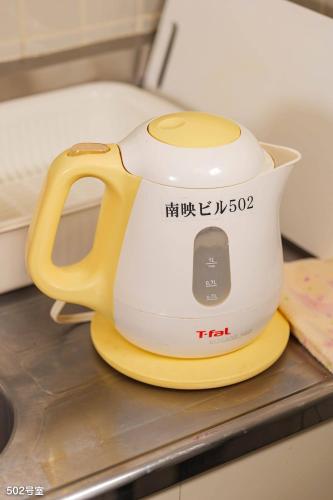 a tea kettle sitting on top of a counter at NanEi Building in Kagoshima