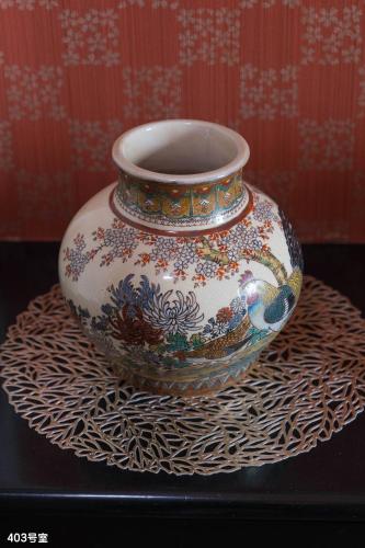 a vase sitting on top of a table at NanEi Building in Kagoshima
