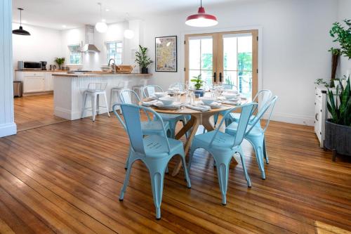 a kitchen and dining room with a table and chairs at 1850 Catskills Farmhouse on 8 acres in E. Durham in East Durham
