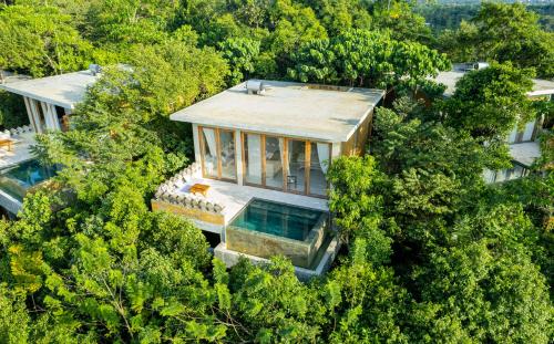 an overhead view of a house in the trees at Malabar Hill in Weligama