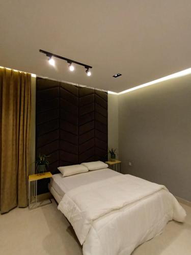 Ένα ή περισσότερα κρεβάτια σε δωμάτιο στο Beach Front Apartment