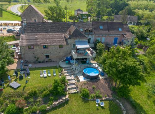 an aerial view of a house with a swimming pool at La Maison de la Colline 