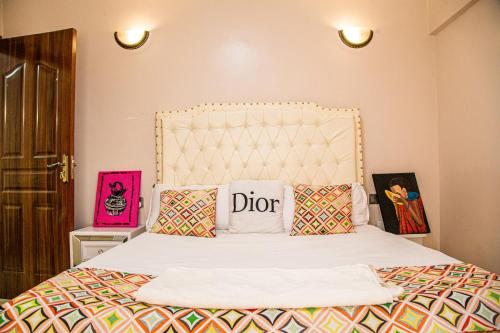 a bedroom with a bed with two pillows on it at The Fancy Luxurious 3 bedroom apartment in Nakuru