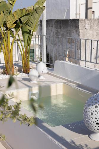 a pool of water on top of a building at Dimore di Brando Vico Gelso in Polignano a Mare