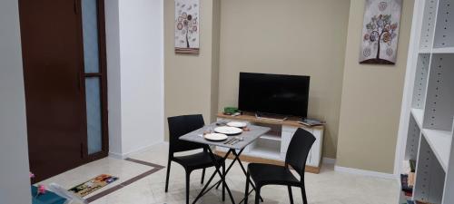 A television and/or entertainment centre at Leam Apartment 5