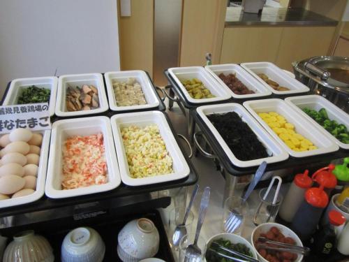 a group of trays of food on a counter at Hotel Nishi In Fujisan in Fuji