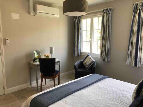 Ένα ή περισσότερα κρεβάτια σε δωμάτιο στο Riverside Lodge